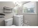 Bathroom featuring a white vanity with drawers, an oval mirror, and a toilet at 1985 Thomasville Se Dr, Atlanta, GA 30315