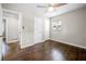 Comfortable bedroom with ceiling fan, hardwood floors, and a neutral color scheme at 1985 Thomasville Se Dr, Atlanta, GA 30315
