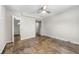 Spacious bedroom with ceiling fan, neutral walls, and multiple closets at 1985 Thomasville Se Dr, Atlanta, GA 30315
