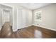 Cozy bedroom with hardwood floors and natural light from the window at 1985 Thomasville Se Dr, Atlanta, GA 30315