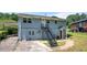Back exterior of home featuring a metal staircase and a carport at 1985 Thomasville Se Dr, Atlanta, GA 30315