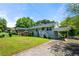 Charming single Gathering home boasts beautiful landscaping and a covered parking area at 1985 Thomasville Se Dr, Atlanta, GA 30315