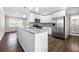 Modern kitchen with stainless steel appliances, granite countertops, and bright white cabinetry at 1985 Thomasville Se Dr, Atlanta, GA 30315