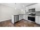 Modern kitchen with stainless steel appliances, granite countertops and hardwood flooring at 1985 Thomasville Se Dr, Atlanta, GA 30315