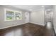 Inviting living room features hardwood floors, trim work and a view of the front yard at 1985 Thomasville Se Dr, Atlanta, GA 30315