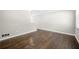 Well lit living room showcasing hardwood floors that leads into an adjacent room at 1985 Thomasville Se Dr, Atlanta, GA 30315