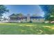 The home's backyard featuring a screened porch and green lawn at 200 Compton Ct, Mcdonough, GA 30252
