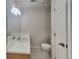 Clean, bright bathroom featuring white cabinets, toilet, and tile flooring at 200 Compton Ct, Mcdonough, GA 30252