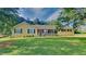 Charming single-story home featuring a well-manicured lawn, inviting front porch, and classic curb appeal at 200 Compton Ct, Mcdonough, GA 30252