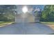 Home exterior featuring attached garage and concrete driveway at 200 Compton Ct, Mcdonough, GA 30252