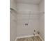 Bright laundry room featuring wire shelving and neutral walls at 200 Compton Ct, Mcdonough, GA 30252