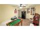 Finished basement featuring a foosball table, refrigerator, and arcade game at 4541 Meadow Club Dr, Suwanee, GA 30024