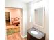Half bathroom with modern vanity and decorative mirror at 4541 Meadow Club Dr, Suwanee, GA 30024
