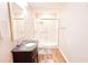 Bathroom featuring a glass shower, updated vanity, and tiled walls at 4541 Meadow Club Dr, Suwanee, GA 30024