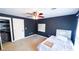 Bedroom with carpet, ceiling fan, walk-in closet, and dry erase board at 4541 Meadow Club Dr, Suwanee, GA 30024
