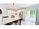 Open kitchen with island, stainless steel appliances, and access to the outdoor space at 4541 Meadow Club Dr, Suwanee, GA 30024