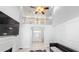 Large living room with cathedral ceilings, decorative fireplace, and hardwood floors at 4541 Meadow Club Dr, Suwanee, GA 30024