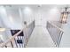 Carpeted loft area featuring wood handrails and black iron balusters with chandelier at 4541 Meadow Club Dr, Suwanee, GA 30024
