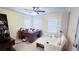 Home office features ample natural light, desk, chair, and a convenient pullout recliner at 4541 Meadow Club Dr, Suwanee, GA 30024
