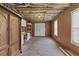Unfinished basement area featuring a storage cabinet and concrete flooring at 9507 Greens Mill Ct, Loganville, GA 30052
