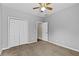 Bedroom featuring neutral walls, carpet and closet space at 9507 Greens Mill Ct, Loganville, GA 30052