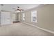 Spacious bedroom with neutral carpet, two windows, and ample closet space at 9507 Greens Mill Ct, Loganville, GA 30052