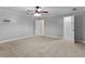 Large bedroom features neutral carpet, white trim, and closet at 9507 Greens Mill Ct, Loganville, GA 30052