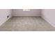Bedroom featuring neutral walls, carpet and a window at 9507 Greens Mill Ct, Loganville, GA 30052