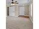 Bedroom showcasing neutral walls, carpeting, two closets, and multiple doorways at 9507 Greens Mill Ct, Loganville, GA 30052