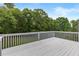 White deck with trees in the background at 9507 Greens Mill Ct, Loganville, GA 30052