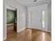 Inviting foyer showcases gleaming wood floors and a view into the office space at 9507 Greens Mill Ct, Loganville, GA 30052