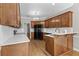 Well-equipped kitchen with quartz countertops, dark appliances, and hardwood flooring at 9507 Greens Mill Ct, Loganville, GA 30052