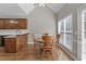 Charming breakfast nook area with hardwood floors, bright windows, and kitchen access at 9507 Greens Mill Ct, Loganville, GA 30052