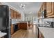 Spacious kitchen boasting wood floors, stainless steel appliances, and an adjacent dining area at 9507 Greens Mill Ct, Loganville, GA 30052
