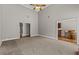 Open living area with vaulted ceilings and neutral carpeting, offering a bright and airy feel at 9507 Greens Mill Ct, Loganville, GA 30052