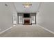Inviting living room with a fireplace, ceiling fan, and access to the outdoor space at 9507 Greens Mill Ct, Loganville, GA 30052