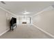 Living room with neutral walls, carpet, and a TV at 9507 Greens Mill Ct, Loganville, GA 30052