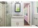 Bathroom showcases glass enclosed shower and vanity with granite countertop at 1663 Pounds Sw Rd, Stone Mountain, GA 30087