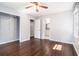 Bedroom with hardwood floors, closet, and access to an en-suite bathroom at 1663 Pounds Sw Rd, Stone Mountain, GA 30087