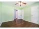 Bedroom boasts hardwood floors, two closets and view to the bathroom at 1663 Pounds Sw Rd, Stone Mountain, GA 30087