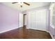 Bedroom boasts hardwood floors, ceiling fan, window views and ample closet space at 1663 Pounds Sw Rd, Stone Mountain, GA 30087