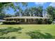 Charming brick home with lush front lawn and meticulously maintained landscaping at 1663 Pounds Sw Rd, Stone Mountain, GA 30087