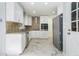 Updated kitchen features stainless steel appliances, granite counters, and tile floors at 1663 Pounds Sw Rd, Stone Mountain, GA 30087