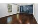 Bright living room featuring hardwood floors and custom built-in shelving at 1663 Pounds Sw Rd, Stone Mountain, GA 30087