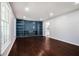 Spacious living room with hardwood floors and built-in bookshelves at 1663 Pounds Sw Rd, Stone Mountain, GA 30087