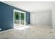 Living room with sliding glass door access to the wooden deck at 1663 Pounds Sw Rd, Stone Mountain, GA 30087
