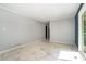 Open concept living room with gray walls and light porcelain tile floors at 1663 Pounds Sw Rd, Stone Mountain, GA 30087