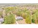 Aerial view of a charming home nestled amongst lush green trees and foliage at 408 Gray Fox Dr, Canton, GA 30114