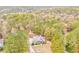 Aerial view of a charming home nestled amongst lush green trees and foliage at 408 Gray Fox Dr, Canton, GA 30114