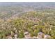 Scenic aerial shot of a home surrounded by a dense forest at 408 Gray Fox Dr, Canton, GA 30114